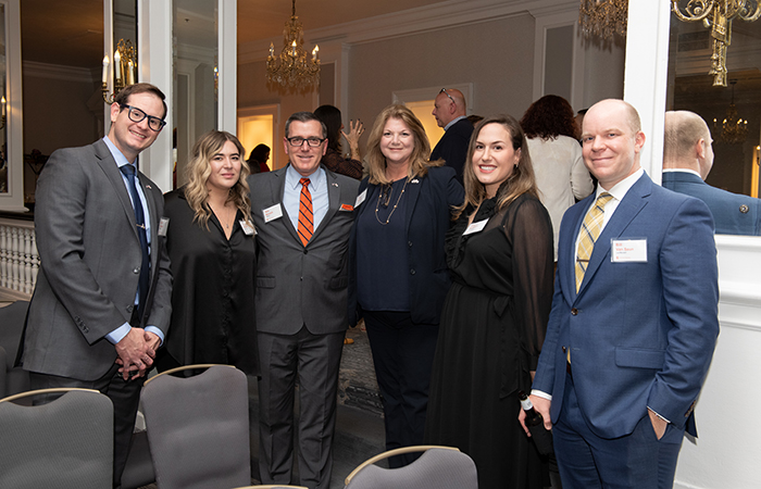 A group of guests pose for a photo.